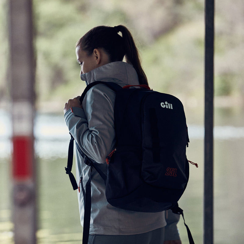 Lifestyle image of woman carrying backpack over shoulder