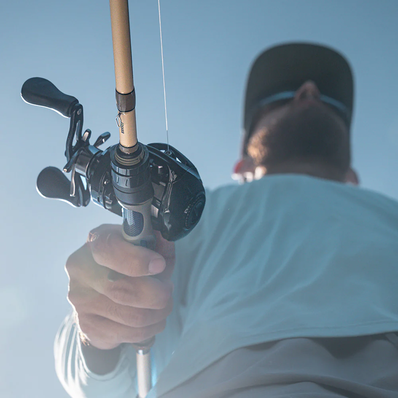 Left-handed reel being held