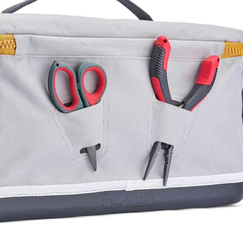 back view of tackle bag with pliers and scissor in tool sleeves