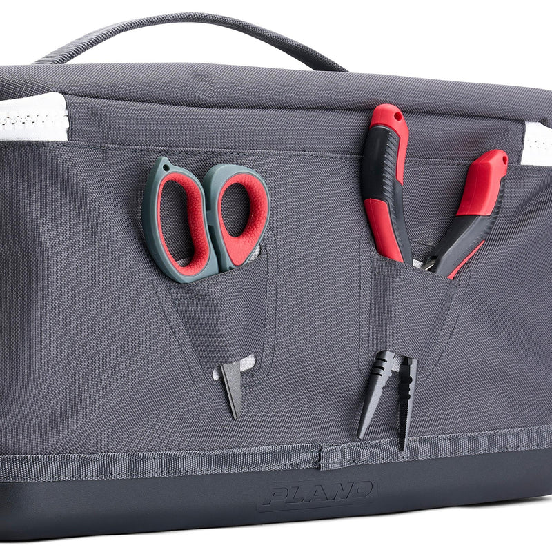 Gray tool bag with scissors and pliers on a white background