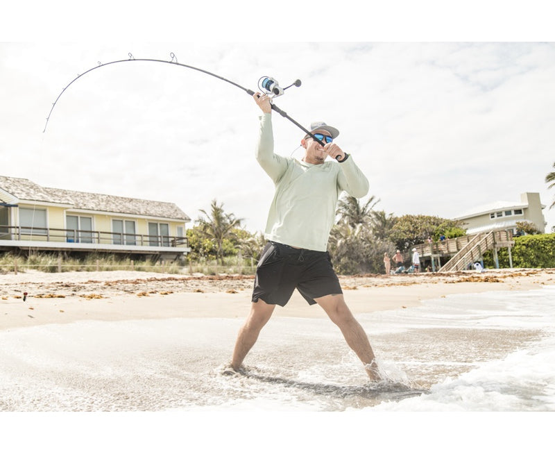 man fishing with Zeal rod from beach 