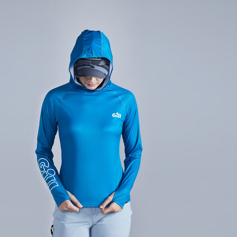 model wearing Gill XPEL Tec with hood up using thumb loops