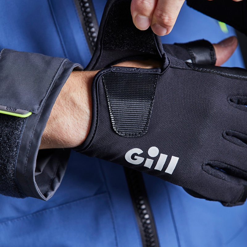 model wearing GILL Championship Gloves - showing velcro adjustment on top