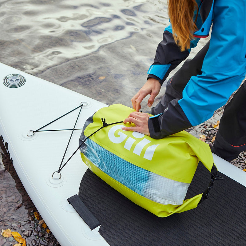 25L drybag being loaded on paddleboard