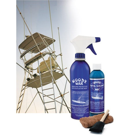 Two bottles of Woody Wax products with a brush and cloth on a white background.