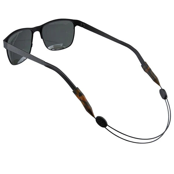 Sunglasses with a black and tortoise shell cord on a white background