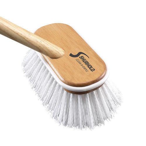 Close up of white bristles with wooden handle