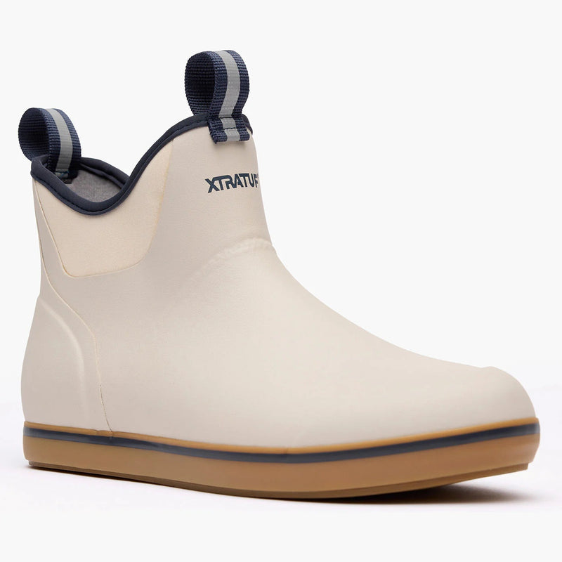 Beige rubber boot with brown sole on a white background