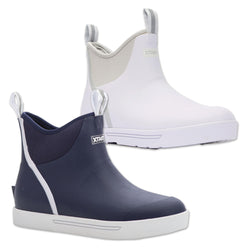 Navy and white rain boots with Xtratuf branding on a white background
