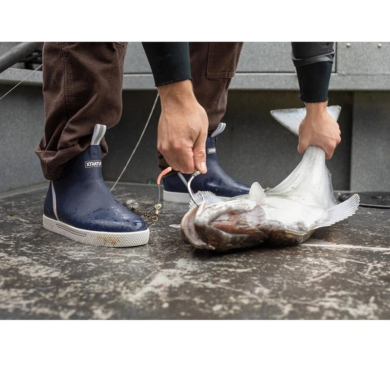 image of person wearing navy boots