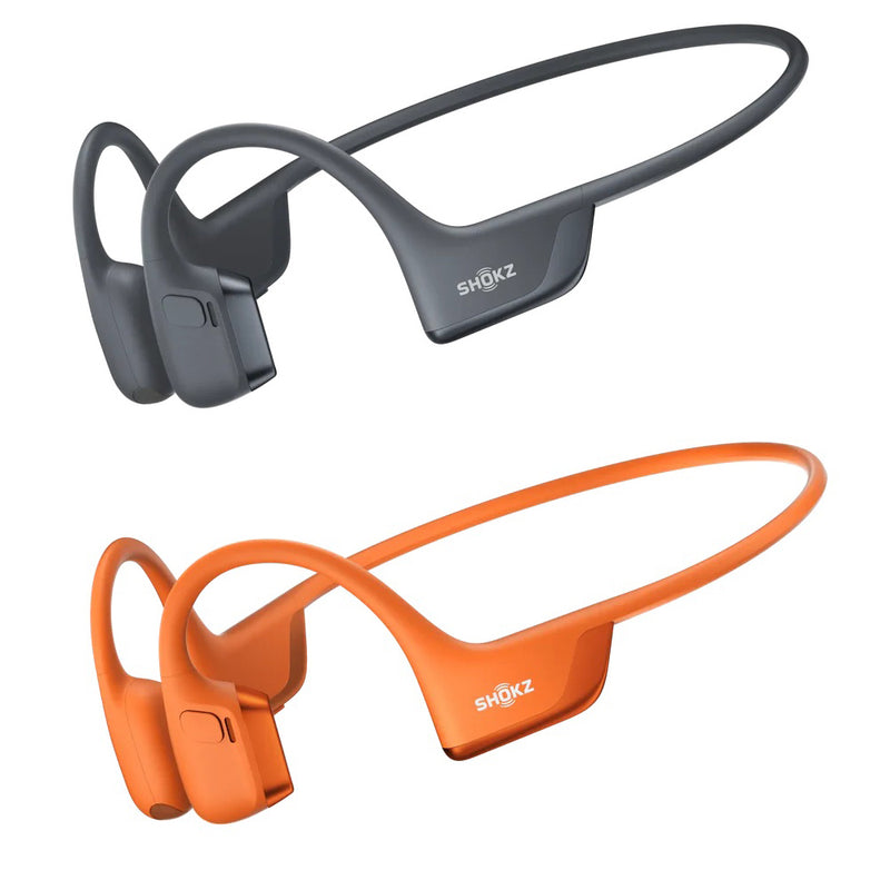Black and orange Shokz headphones on a white background
