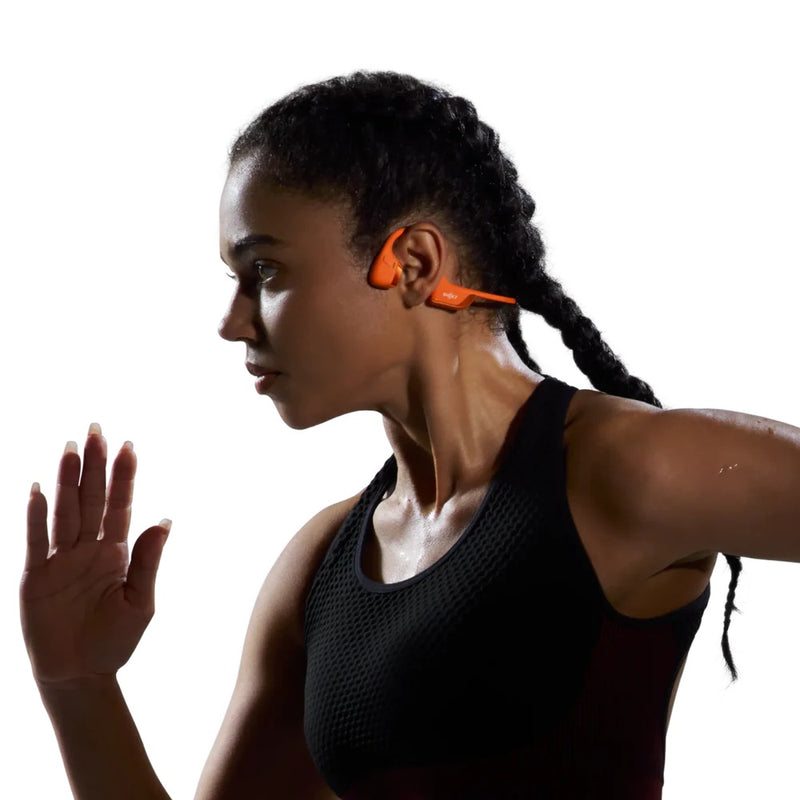 woman wearing orange headphones