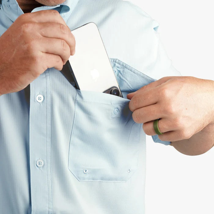 close up putting phone in front pocket