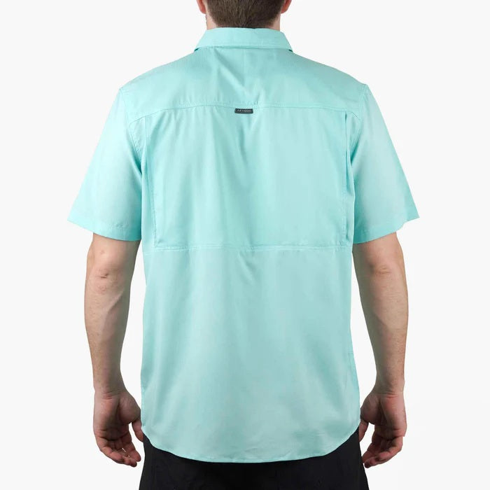 man wearing turquoise shirt - back view