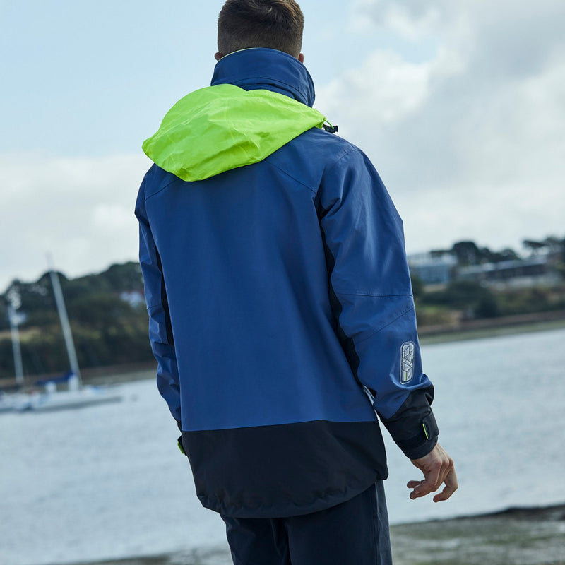 Lifestyle image back view of Men's Coastal Jacket Ocean with hood out