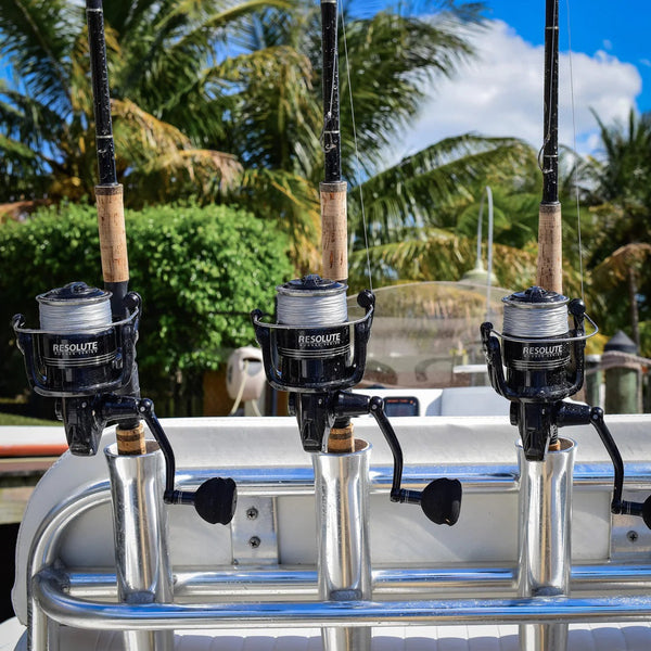 image of 3 Resolute reels on rods in rod holders on boat