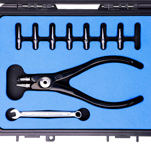 Pliers shown in case with accessories