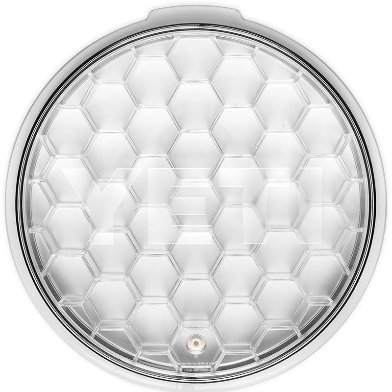 Transparent circular lid with hexagonal pattern.