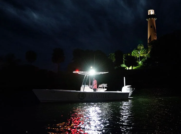 image of boat at night with light shining