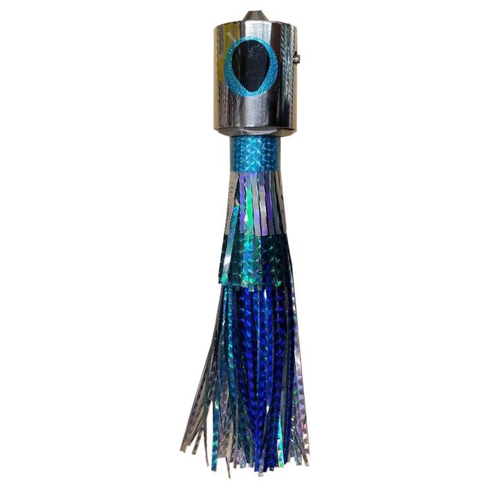Fishing lure with chrome head, yellow and black eyes, and blue and silver skirt