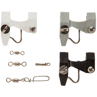 3 fishing release clips. One white, gray, and black next to 3 silver metal swivels