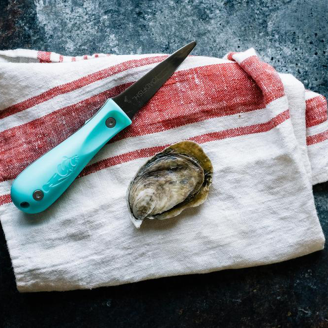Blade and oyster on a towel