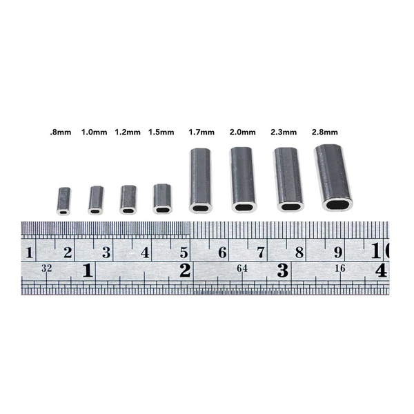 Aluminum sleeves showing sizes with ruler for scale
